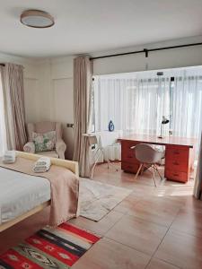 Postel nebo postele na pokoji v ubytování POPSY HOMES NAKURU CBD
