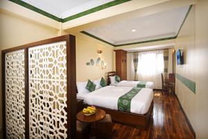 Voodi või voodid majutusasutuse Tibet Boutique Hotel toas