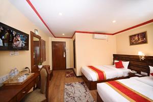Voodi või voodid majutusasutuse Tibet Boutique Hotel toas