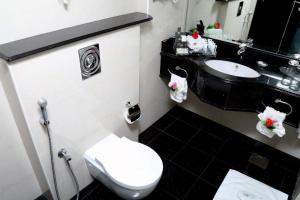 Ванная комната в Royal Grand Suite Hotel