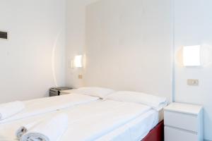 Postel nebo postele na pokoji v ubytování Hotel Regina
