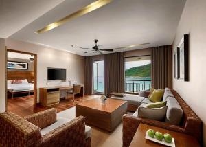 a living room with a couch and a table at The Taaras Beach & Spa Resort in Redang Island