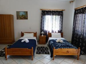 Ένα ή περισσότερα κρεβάτια σε δωμάτιο στο Taygetos Apartments