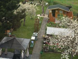 an aerial view of a garden with flowers and a house at Ferienwohnung Conradt in Arnstadt
