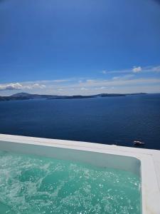 a view of a large body of water at Phaos Oia Suites in Oia