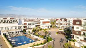 an aerial view of a city with buildings and a pool at Zephyr Agadir in Agadir
