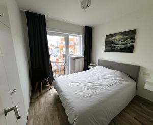 เตียงในห้องที่ Appartement Mandarin met gratis parkeerplaats +8 ภาพ