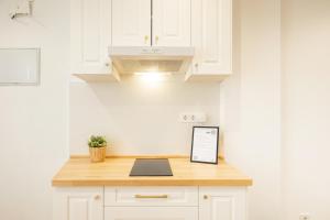 Kuchyň nebo kuchyňský kout v ubytování ISG Apartments Triana 1