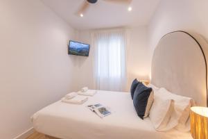 Postel nebo postele na pokoji v ubytování ISG Apartments Triana 1
