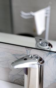 a close up of a table with a toothbrush at Casa CharmaRt in Asti +47 photos