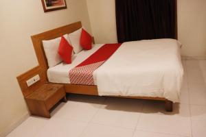 Postel nebo postele na pokoji v ubytování Hotel Anuha