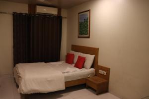 Postel nebo postele na pokoji v ubytování Hotel Anuha