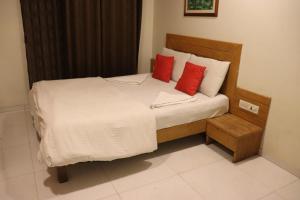 Postel nebo postele na pokoji v ubytování Hotel Anuha