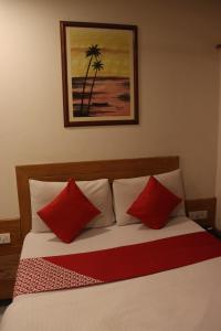 Postel nebo postele na pokoji v ubytování Hotel Anuha