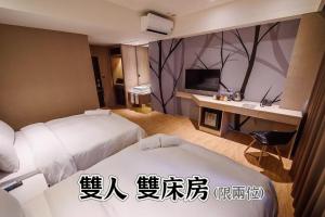 Letto o letti in una camera di SIX FUKUN HOTEL