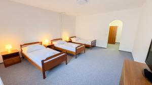 Rúm í herbergi á Nobiles hotel Šternberk