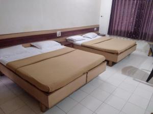 Ένα ή περισσότερα κρεβάτια σε δωμάτιο στο Swamy Resort +10 φωτογραφίες