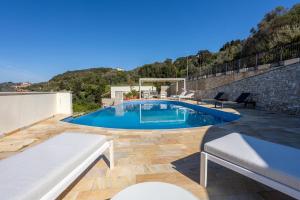 a swimming pool on top of a house at La Vista Azzurra in Lerici