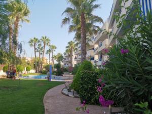 A garden outside Otylia La Calma Sun Apartment With Sea View