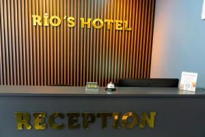 a reception desk with a roos hotel registration sign at Rio's Hotel AİRPORT in Istanbul