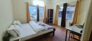Postel nebo postele na pokoji v ubytování JAP Guest House & Apartments + 37 fotografií