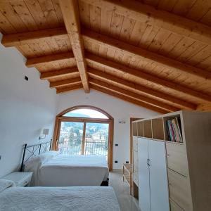 A bed or beds in a room at Villa Primula