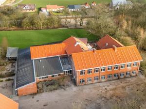 an overhead view of a building with orange roofs at Large Pool House With 15 Bedrooms And Lots Of Activity Options in Erslev