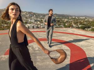 a man and a woman walking on top of a building at Hotel Sofitel Los Angeles at Beverly Hills in Los Angeles