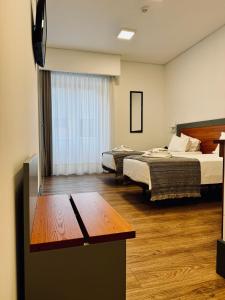 Postel nebo postele na pokoji v ubytování Aliança café & hostel + 37 fotografií