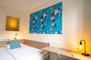 Letto o letti in una camera di Hotel Madeleine Biohotel