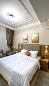 A bed or beds in a room at Teba Hotel Ras Elbar