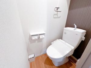 a bathroom with a white toilet in a stall at Legatio HAKATA in Fukuoka +24 photos