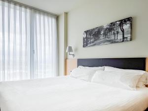 Posteľ alebo postele v izbe v ubytovaní Hotel Jardines de Uleta Suites