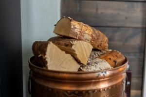 a bucket full of different types of bread at #Reinehuset - Amazing view! in Reine +56 photos