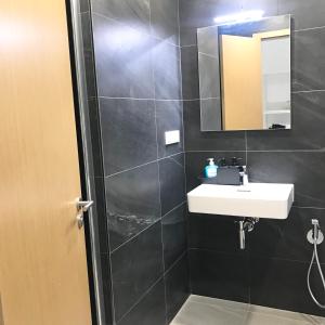 a bathroom with a sink and a mirror at Apartmantplus01 in Prague +15 photos