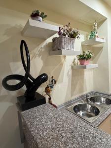 a sink in a kitchen with a black faucet at Venis House in Plovdiv +60 photos