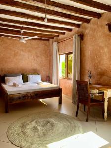 Postel nebo postele na pokoji v ubytování Waridi Room at Lulu Sands