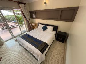 Postel nebo postele na pokoji v ubytování Hello Kampot Resort