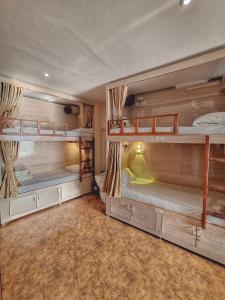 a room with two bunk beds in it at Sheetal Dormitoy in Mumbai