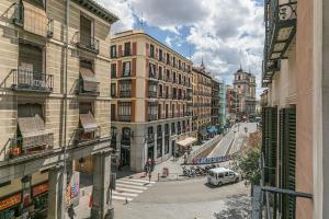 a view of a street in a city with buildings at Plaza Mayor by Forever Rentals in Madrid