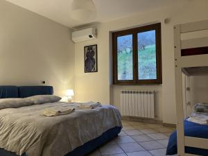 Ένα ή περισσότερα κρεβάτια σε δωμάτιο στο Casa di Farfa