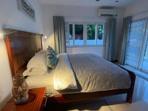 Postel nebo postele na pokoji v ubytování Tropic Villa Annex