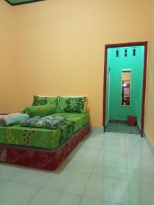 Postel nebo postele na pokoji v ubytování Zinzi's All-Inclusive Homestay