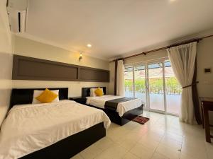 Postel nebo postele na pokoji v ubytování Hello Kampot Resort + 13 fotografií
