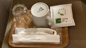 a box with a tray with a cup and other items at Easy Stay Chichibu in Chichibu