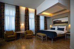 Postel nebo postele na pokoji v ubytování Opera Hotel