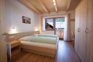 Ένα ή περισσότερα κρεβάτια σε δωμάτιο στο Hölzlhof Apartments