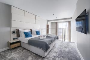 Posteľ alebo postele v izbe v ubytovaní ApartamentyPrzyMorzu Marine***** apartament dwupoziomowy z widokiem na morze
