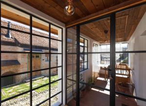 an internal view of a house with large glass windows at Critz Cross in Criţ