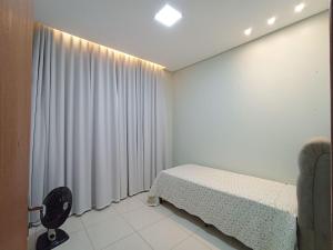 Ένα ή περισσότερα κρεβάτια σε δωμάτιο στο Casa Jardim Imperial